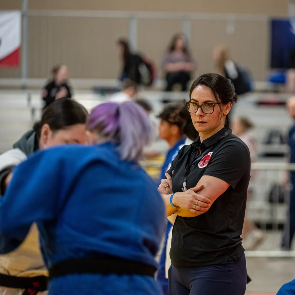 High Noon Judo Deputy Director Heidi Holz looks on as she warms up the team.